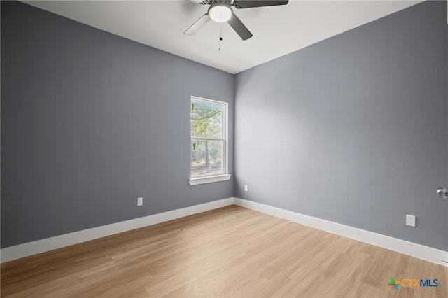 unfurnished room with ceiling fan and light wood-type flooring