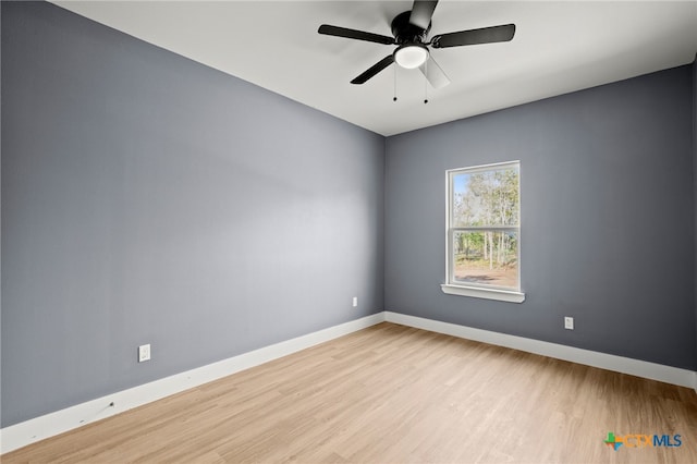 unfurnished room featuring light hardwood / wood-style flooring and ceiling fan