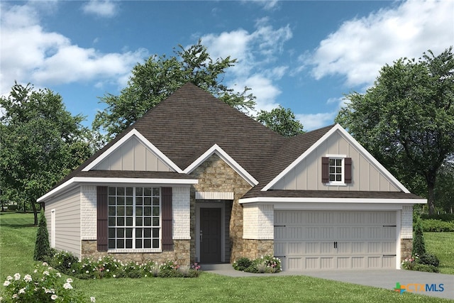 view of front of home with a front yard and a garage