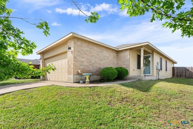 216 Pullman Place Blvd, Temple, TX 76502 - view of front of home with brick siding, a garage, and driveway