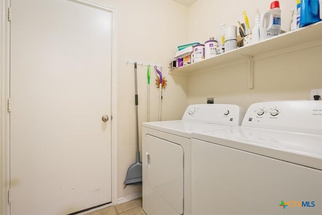 216 Pullman Place Blvd, Temple, TX 76502 - clothes washing area featuring washer and dryer and light tile patterned flooring