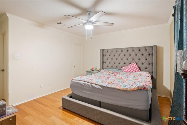 216 Pullman Place Blvd, Temple, TX 76502 - bedroom with wood finished floors, ornamental molding, a ceiling fan, and baseboards