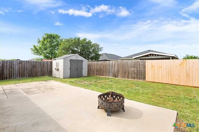 216 Pullman Place Blvd, Temple, TX 76502 - view of patio featuring a fire pit, a shed, and an outbuilding