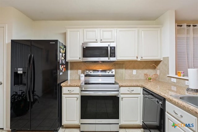 216 Pullman Place Blvd, Temple, TX 76502 - kitchen featuring black appliances, light tile patterned floors, white cabinetry, and backsplash