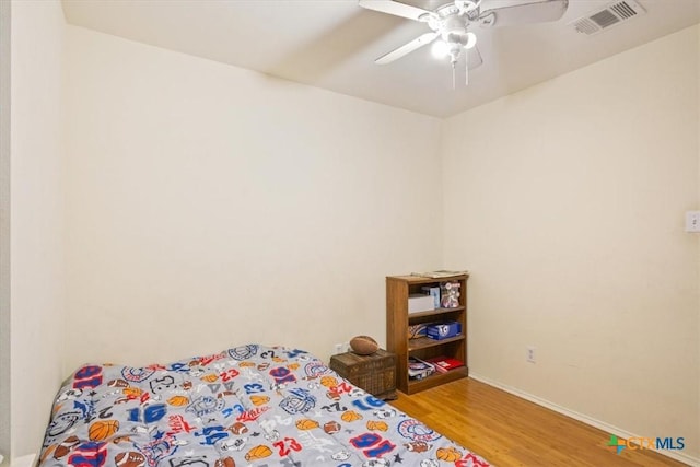 216 Pullman Place Blvd, Temple, TX 76502 - bedroom with wood finished floors, ceiling fan, and baseboards