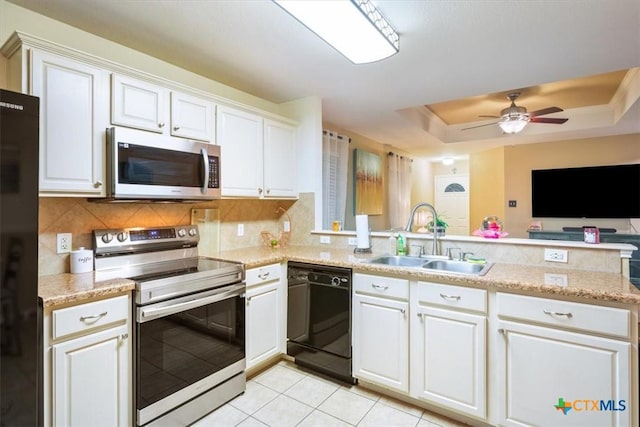 216 Pullman Place Blvd, Temple, TX 76502 - kitchen featuring black appliances, a sink, tasteful backsplash, a peninsula, and light tile patterned flooring