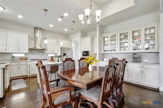 1812 Gibraltar Dr, San Marcos, TX 78666 - dining space with dark wood-type flooring, recessed lighting, and a chandelier