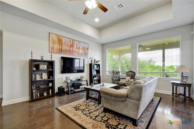 1812 Gibraltar Dr, San Marcos, TX 78666 - living room featuring baseboards, a ceiling fan, dark wood-style flooring, and a raised ceiling