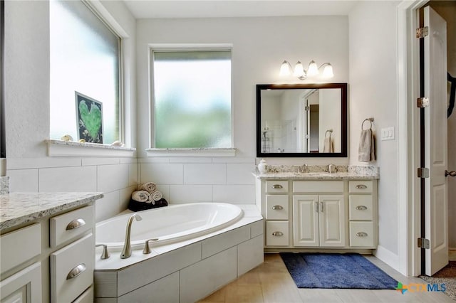 1812 Gibraltar Dr, San Marcos, TX 78666 - bathroom with a bath, tile patterned floors, and vanity