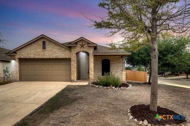 view of front of property with a garage