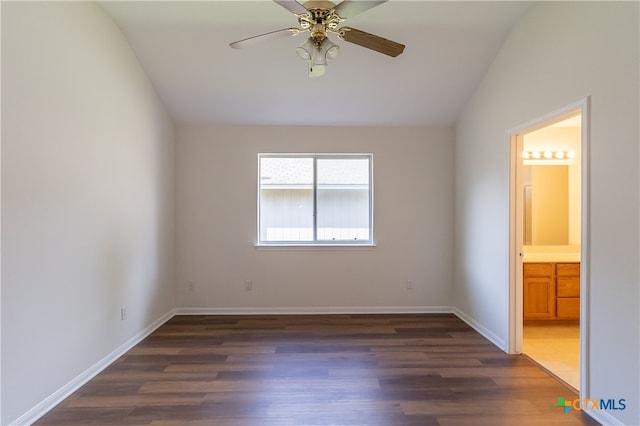 unfurnished bedroom with ensuite bath, lofted ceiling, ceiling fan, and dark hardwood / wood-style flooring