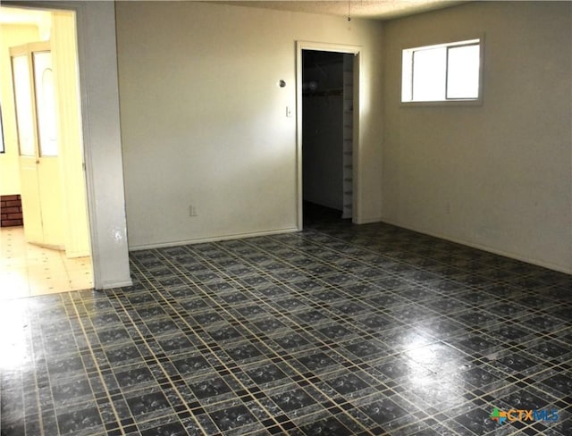 765 Benchmark Trl, Belton, TX 76513 - spare room featuring tile patterned floors
