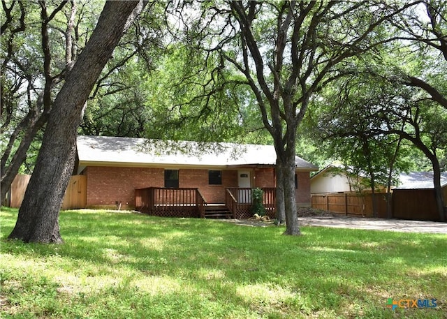 765 Benchmark Trl, Belton, TX 76513 - back of house with a wooden deck and brick siding