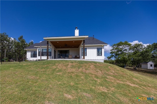 150 Panorama Dr, Wimberley, TX 78676 - back of house with a ceiling fan, a chimney, a yard, a patio, and board and batten siding