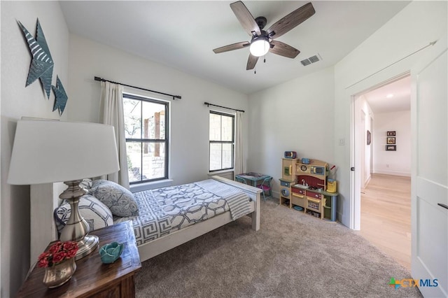 150 Panorama Dr, Wimberley, TX 78676 - carpeted bedroom featuring a ceiling fan
