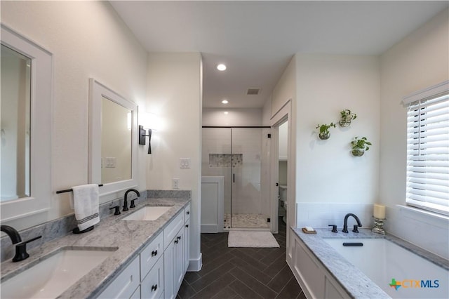 150 Panorama Dr, Wimberley, TX 78676 - full bath with a stall shower, double vanity, a garden tub, and recessed lighting