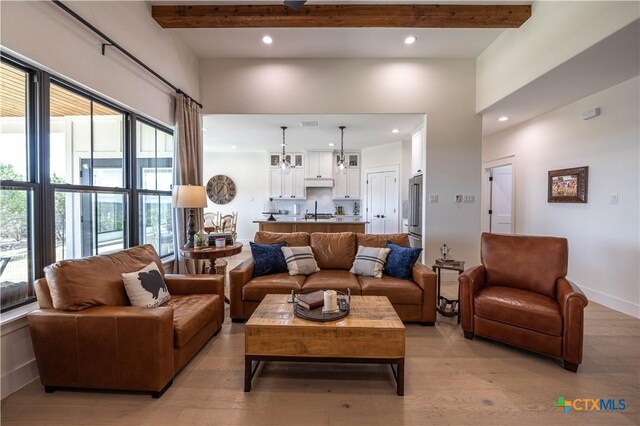 150 Panorama Dr, Wimberley, TX 78676 - living area featuring light wood-style floors, recessed lighting, healthy amount of natural light, and beamed ceiling