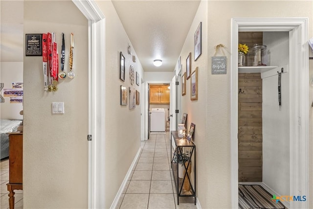 846 Thomas St, Copperas Cove, TX 76522 - corridor featuring washer / dryer and light tile patterned flooring