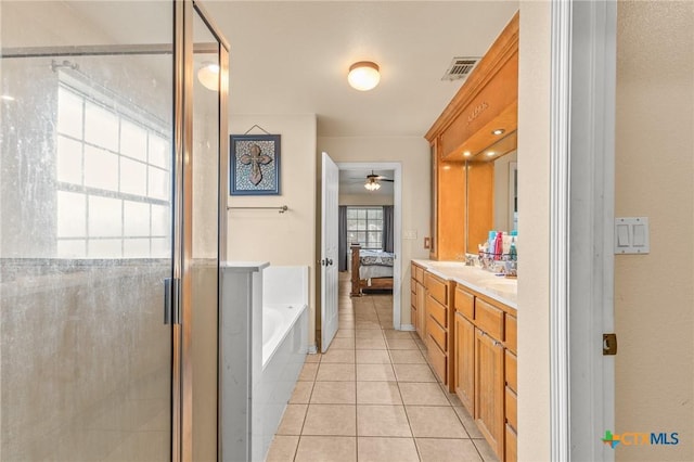 846 Thomas St, Copperas Cove, TX 76522 - bathroom featuring a garden tub, double vanity, a stall shower, tile patterned floors, and connected bathroom