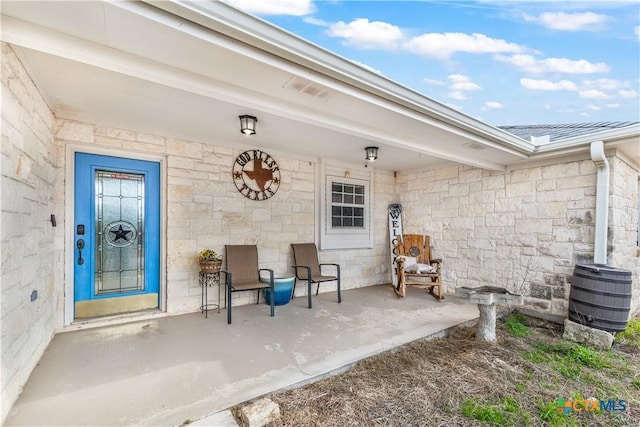 846 Thomas St, Copperas Cove, TX 76522 - doorway to property featuring stone siding and covered porch