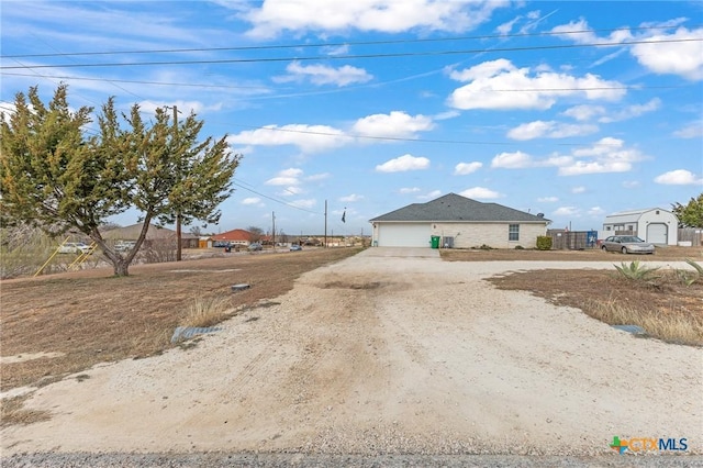 846 Thomas St, Copperas Cove, TX 76522 - view of side of home featuring dirt driveway and an attached garage