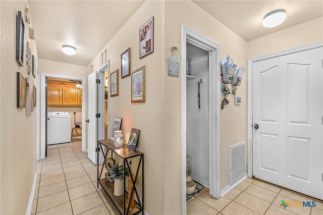 846 Thomas St, Copperas Cove, TX 76522 - hallway with washer / clothes dryer and light tile patterned flooring