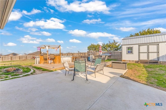 846 Thomas St, Copperas Cove, TX 76522 - view of patio / terrace with a wooden deck, a fire pit, a shed, and outdoor dining area