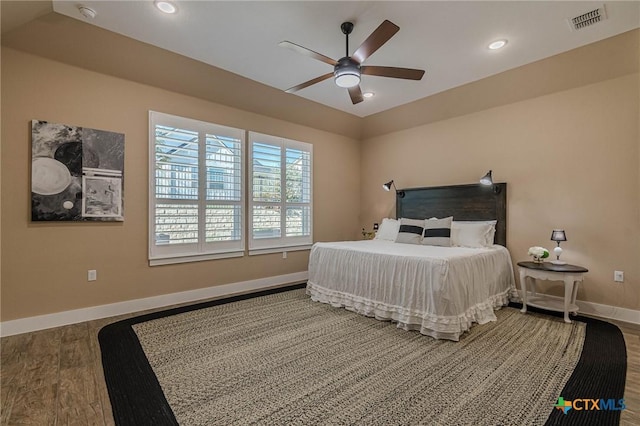 bedroom featuring hardwood / wood-style flooring and ceiling fan