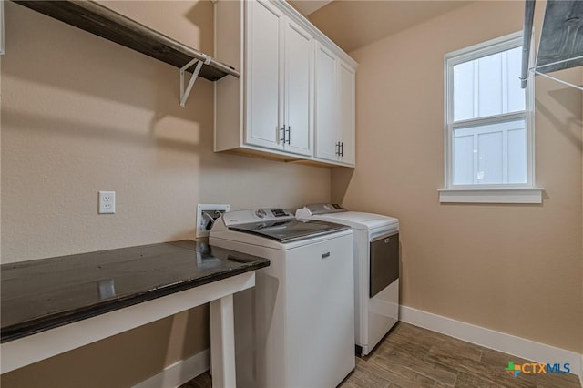 laundry area featuring cabinets and separate washer and dryer