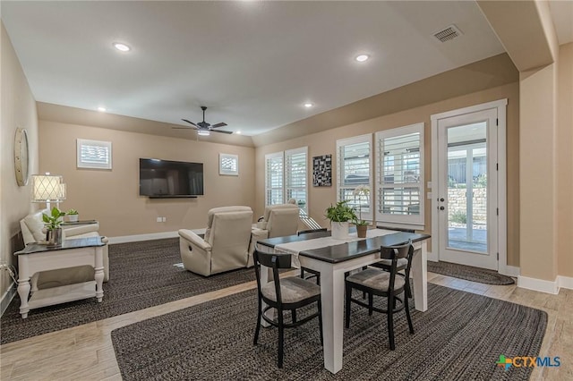 dining space featuring ceiling fan and light hardwood / wood-style flooring