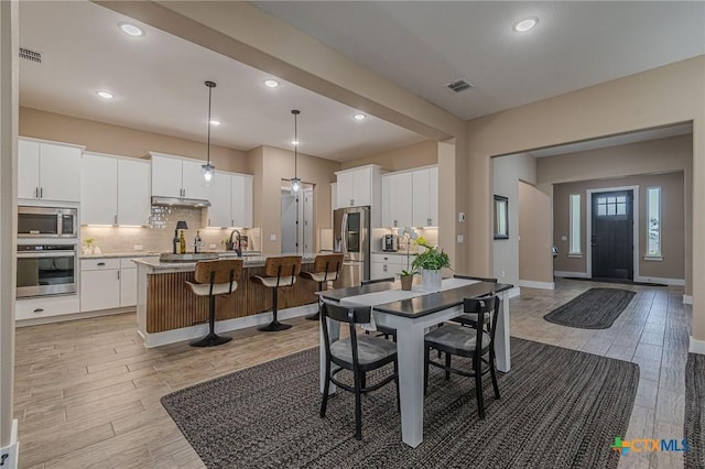 dining space with sink