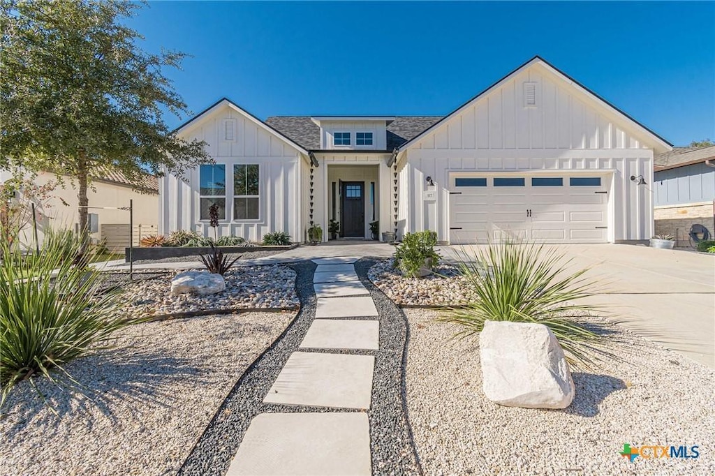117 Cruising Oak St, San Marcos, TX 78666 - modern inspired farmhouse with board and batten siding, driveway, and a garage