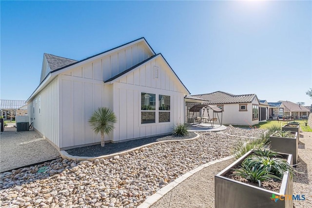 view of home's exterior featuring a patio area and central AC