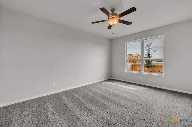 unfurnished room featuring ceiling fan and carpet flooring