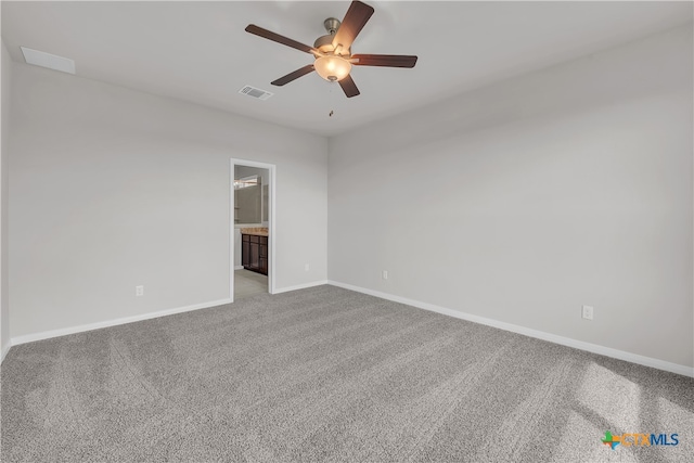 unfurnished room with ceiling fan and light carpet