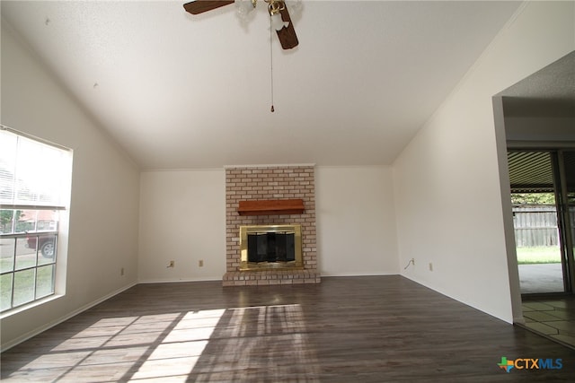 unfurnished living room featuring ceiling fan, dark wood-type flooring, a textured ceiling, vaulted ceiling, and a fireplace