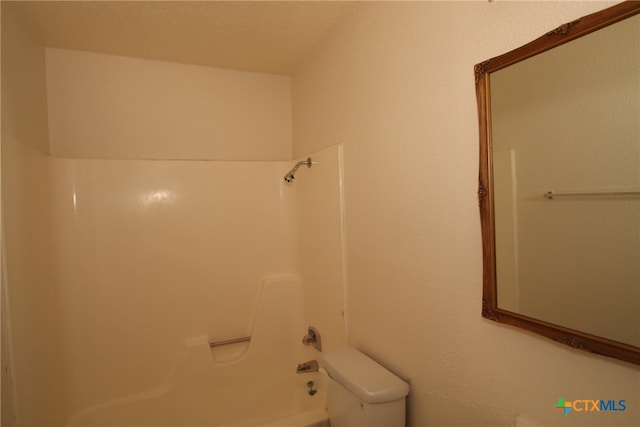 bathroom with toilet and tub / shower combination