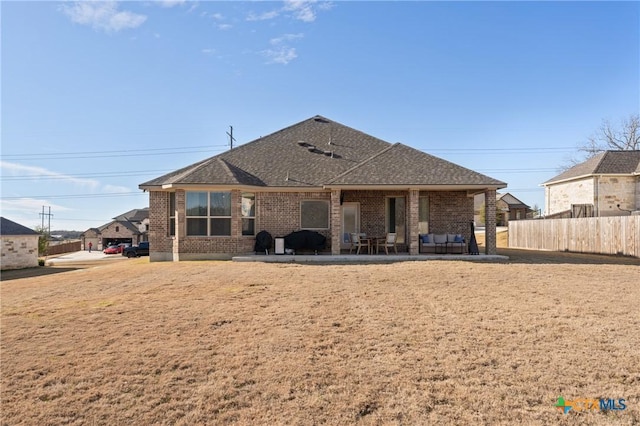 back of property featuring a patio area