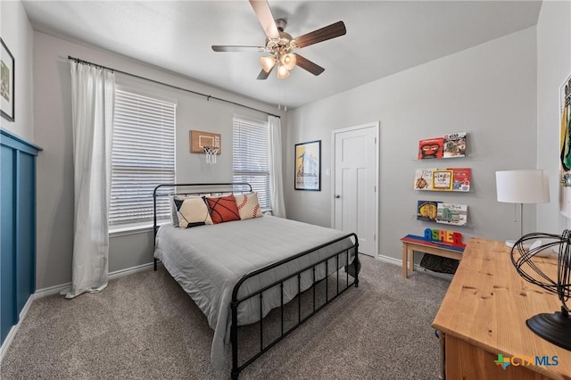 bedroom featuring dark colored carpet and ceiling fan