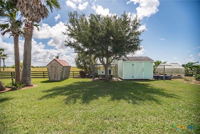 24135 State Highway 172, Port Lavaca, TX 77979 - view of yard featuring a storage unit and an exterior structure