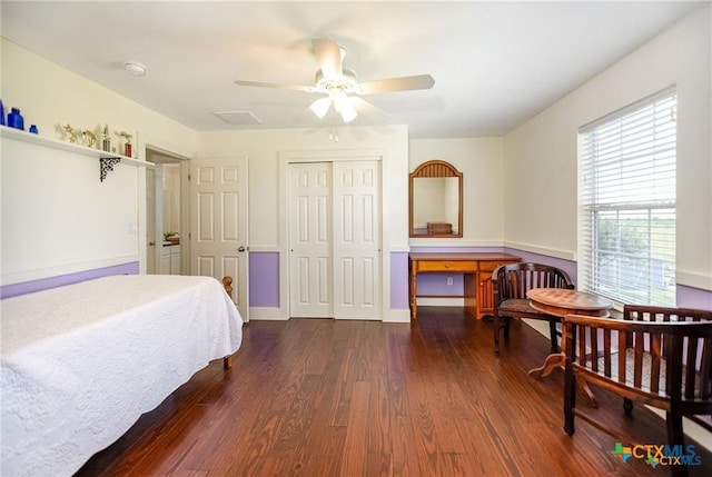 24135 State Highway 172, Port Lavaca, TX 77979 - bedroom with dark wood-style floors, a closet, an office area, and ceiling fan