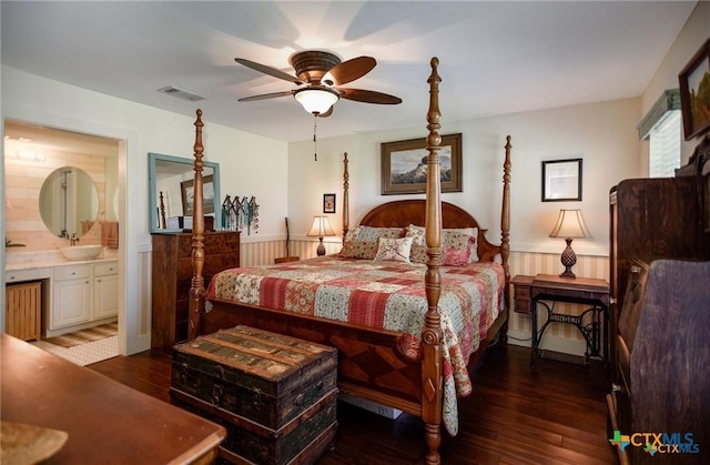 24135 State Highway 172, Port Lavaca, TX 77979 - bedroom with hardwood / wood-style floors, wainscoting, and ensuite bathroom
