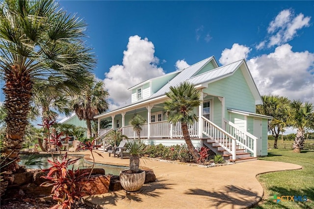 24135 State Highway 172, Port Lavaca, TX 77979 - view of front of property with covered porch and a metal roof