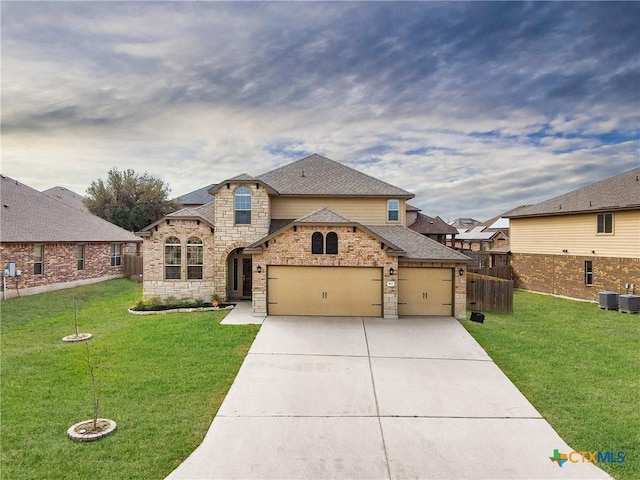 view of front facade featuring a front lawn, cooling unit, and a garage