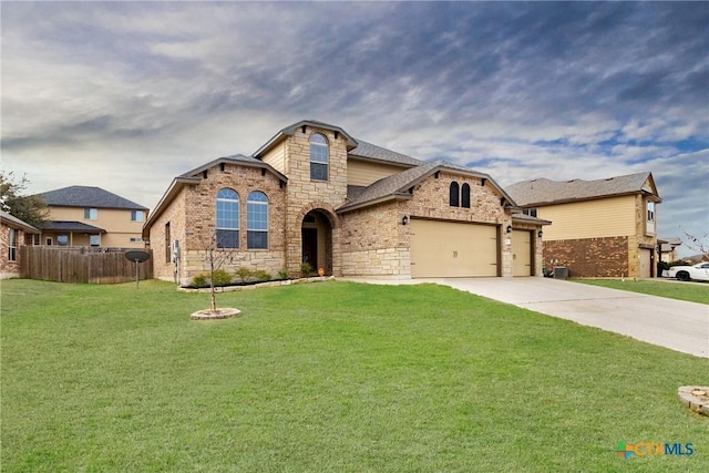 view of front of home with a garage and a front yard