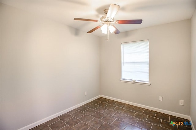 1504 Phyllis Dr, Copperas Cove, TX 76522 - unfurnished room with a ceiling fan, baseboards, and dark tile patterned flooring