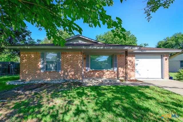 1504 Phyllis Dr, Copperas Cove, TX 76522 - ranch-style home featuring brick siding, an attached garage, and driveway