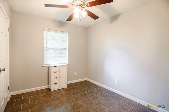 1504 Phyllis Dr, Copperas Cove, TX 76522 - spare room with a ceiling fan, baseboards, and dark tile patterned floors