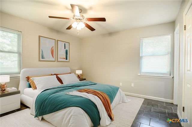 1504 Phyllis Dr, Copperas Cove, TX 76522 - bedroom with multiple windows, baseboards, and a ceiling fan