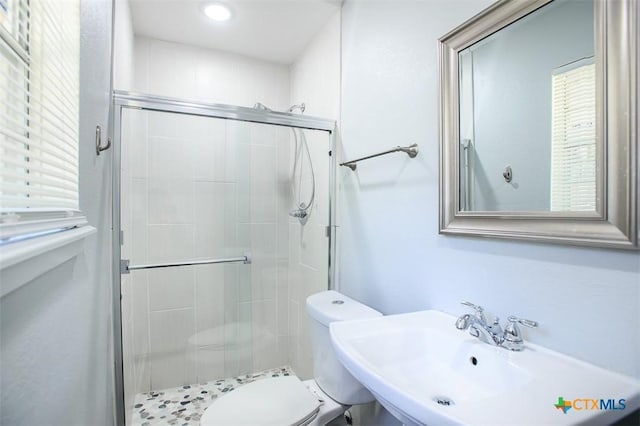 1504 Phyllis Dr, Copperas Cove, TX 76522 - bathroom with toilet, a shower stall, a sink, and healthy amount of natural light
